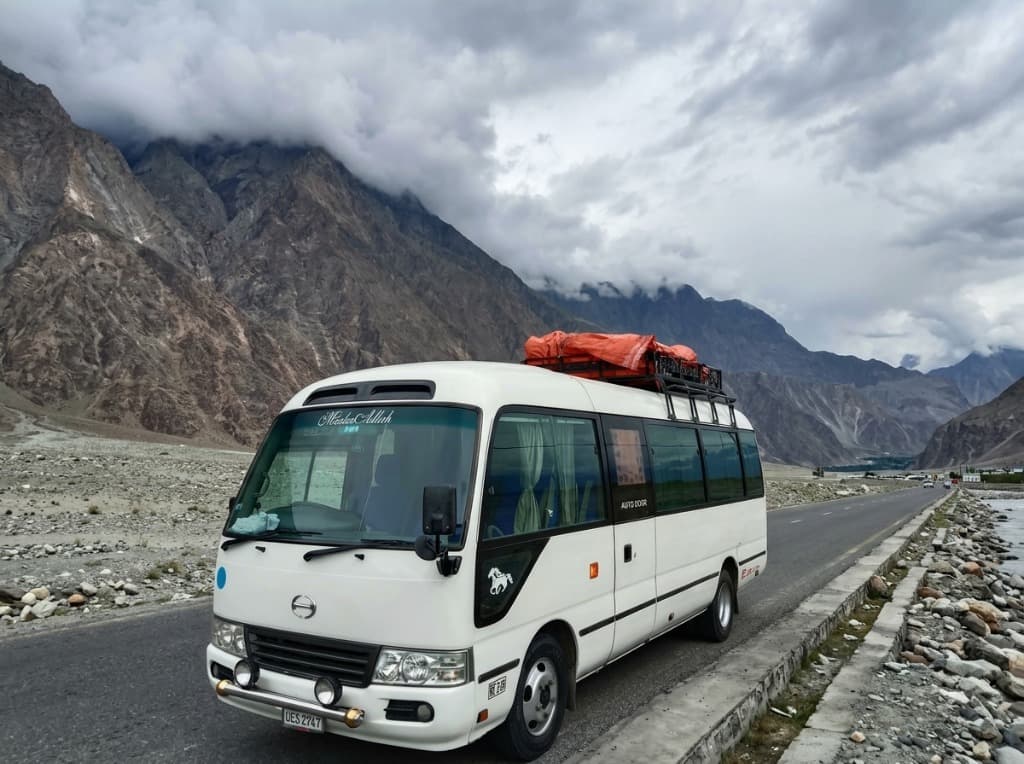 Usama Transport Solution Toyota Coaster bus on a group sightseeing tour in Karakoram, Pakistan